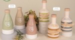 Oliera Elisir in ceramica da 13.5cm con decoro a cuore, disponibile in colori pastello, ideale come bomboniera utile per matrimonio e comunione. 02a406-02a407