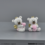 Coppia di bomboniere orsetto rosa con ali e corona oro per battesimo bambina.