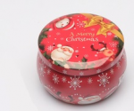 Candela natalizia in barattolo di latta decorato con allegre fantasie a tema Natale, diametro 7 cm.