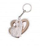 Portachiavi Matrimonio Coppia Sposi axs218/s Portachiavi bomboniera per matrimonio raffigurante una coppia di sposi tridimensionale racchiusa in una cornice a forma di cuore in plexisilver lucido.